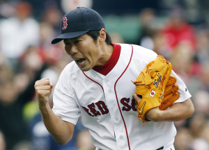 Boston Red Sox pitcher Koji Uehara reacts after Tampa Bay Rays' Ryan Roberts pop out to end the top of the ninth inning with two men left on base during a baseball game in Boston, Saturday, April 13, 2013. (AP Photo/Michael Dwyer)