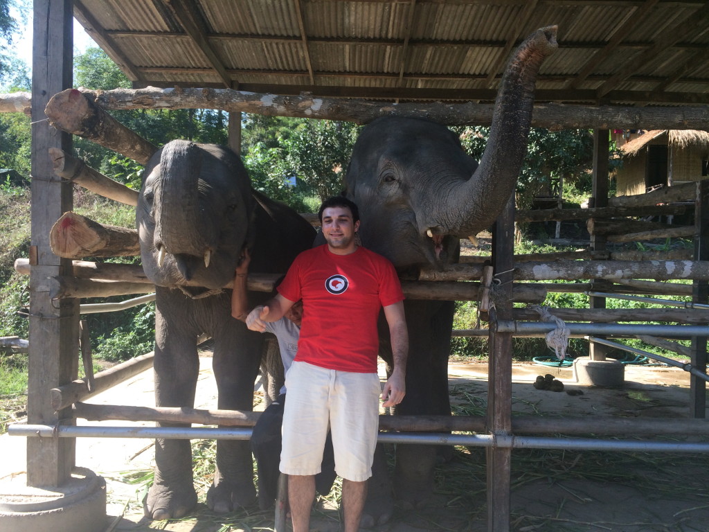 Chris with two elephants