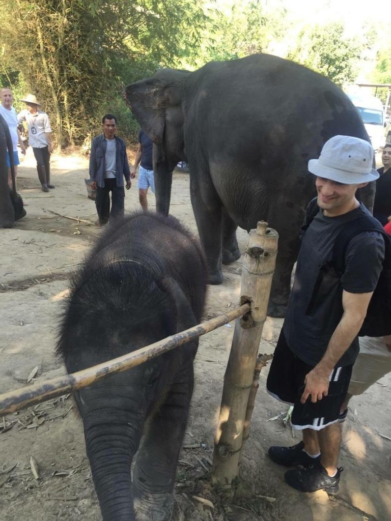 Eli with Lana, a seven-month old elephant, at Elephant Retirement Park in Chang Wat